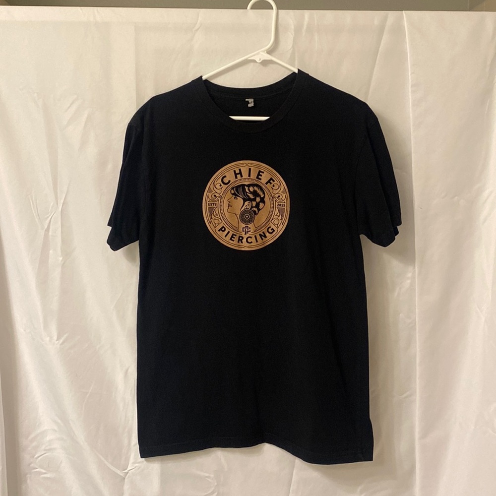 Black t shirt. Black tee shirt. Unisex size medium. Graphic T. Chief’s piercing